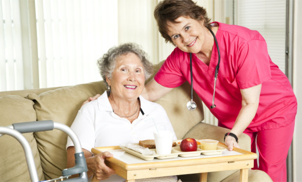 Nurse checking blood pressure of couple