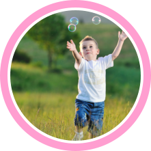 Child playing with bubbles