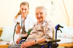 nurse with senior on a wheelchair